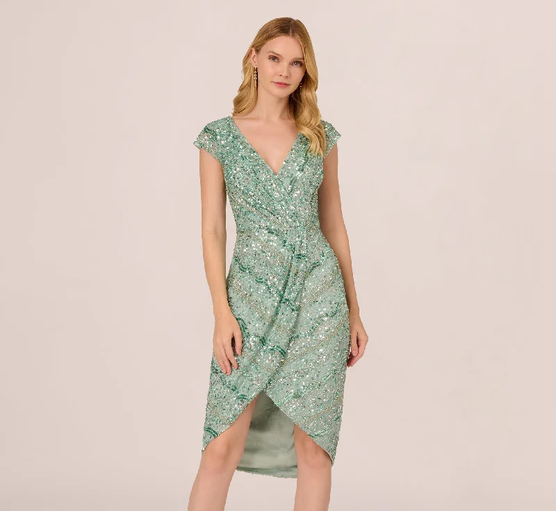 Beaded Faux Wrap Dress With Sheer Cap Sleeves In Icy Sage Elegant Tie-Front Wrap Dress Beaded Faux Wrap Dress With Sheer Cap Sleeves In Icy Sage Elegant Tie-Front Wrap Dress