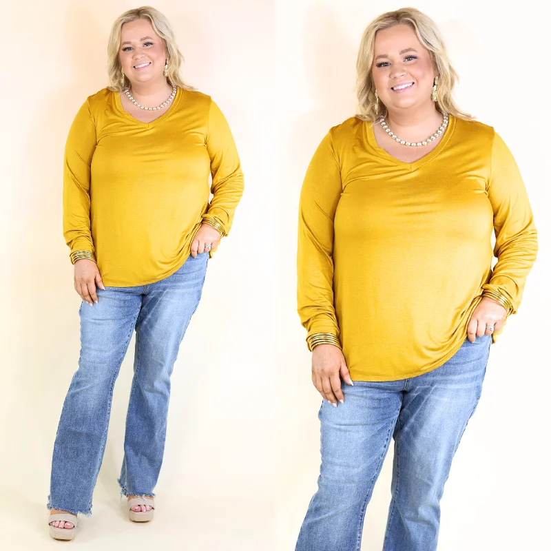 It's That Simple Solid V Neck Long Sleeve Tee in Mustard Yellow Spandex Blend Rayon Blend Denim Blend It's That Simple Solid V Neck Long Sleeve Tee in Mustard Yellow Spandex Blend Rayon Blend Denim Blend
